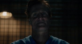 Movie still from “Venom: Let There Be Carnage” (2021), directed by Andy Serkis – A person wearing a blue shirt; Close Up shot, Low angle