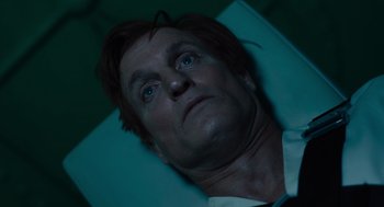 Movie still from “Venom: Let There Be Carnage” (2021), directed by Andy Serkis – A person laying on a bed; Close Up shot, Low angle