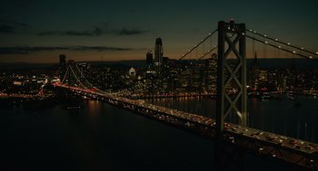 Movie still from “Venom: Let There Be Carnage” (2021), directed by Andy Serkis – A view of a city at night from a bridge; Extreme Wide shot, High angle
