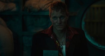 Movie still from “Venom: Let There Be Carnage” (2021), directed by Andy Serkis – A man in a black jacket is looking at the camera; Close Up shot, Low angle