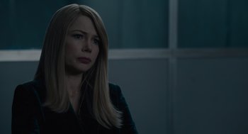 Movie still from “Venom: Let There Be Carnage” (2021), directed by Andy Serkis – A woman with long blonde hair is looking to her left; Close Up shot, Over the shoulder angle