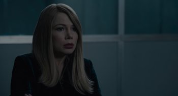 Movie still from “Venom: Let There Be Carnage” (2021), directed by Andy Serkis – A woman with long blonde hair is looking at the camera; Close Up shot, Over the shoulder angle