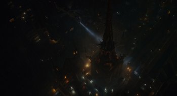 Movie still from “Venom: Let There Be Carnage” (2021), directed by Andy Serkis – An aerial view of a city lit up at night; Extreme Wide shot, Overhead angle