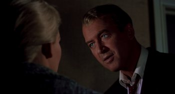 Movie still from “Vertigo” (1958), directed by Alfred Hitchcock – A man and a woman are looking at one another; Close Up shot, Over the shoulder angle