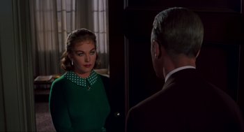 Movie still from “Vertigo” (1958), directed by Alfred Hitchcock – A man and a woman looking at one another in a mirror; Medium shot, Over the shoulder angle