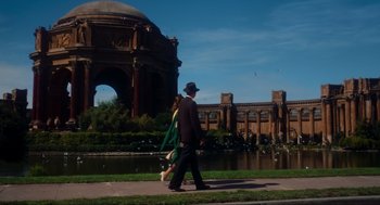 Movie still from “Vertigo” (1958), directed by Alfred Hitchcock – A man and a woman walking down the sidewalk; Extreme Wide shot, Low angle