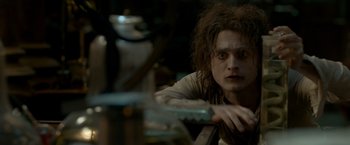 Movie still from “Victor Frankenstein” (2015), directed by Paul McGuigan – A person holding a knife; Close Up shot, Over the shoulder angle