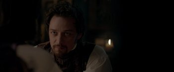 Movie still from “Victor Frankenstein” (2015), directed by Paul McGuigan – A person wearing a shirt and tie; Close Up shot, Over the shoulder angle