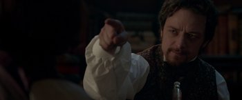 Movie still from “Victor Frankenstein” (2015), directed by Paul McGuigan – A man holding a white piece of paper in his hand; Close Up shot, Over the shoulder angle