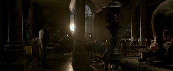 Movie still from “Victor Frankenstein” (2015), directed by Paul McGuigan – A room filled with lots of furniture and a large window; Extreme Wide shot, High angle