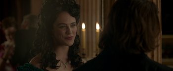 Movie still from “Victor Frankenstein” (2015), directed by Paul McGuigan – A beautiful young lady wearing a necklace in front of a mirror; Close Up shot, Over the shoulder angle