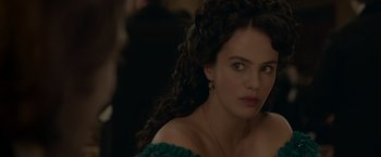 Movie still from “Victor Frankenstein” (2015), directed by Paul McGuigan – A person with long curly hair; Close Up shot, Over the shoulder angle