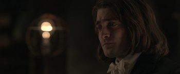 Movie still from “Victor Frankenstein” (2015), directed by Paul McGuigan – A person wearing a bow tie; Close Up shot, Over the shoulder angle