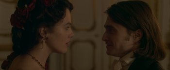 Movie still from “Victor Frankenstein” (2015), directed by Paul McGuigan – A man and a woman face to face in front of a door; Close Up shot, Over the shoulder angle