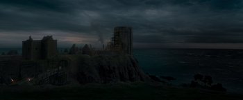Movie still from “Victor Frankenstein” (2015), directed by Paul McGuigan – A castle on top of a hill near the ocean; Extreme Wide shot, High angle