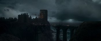 Movie still from “Victor Frankenstein” (2015), directed by Paul McGuigan – A castle on top of a cliff near the ocean; Extreme Wide shot, High angle