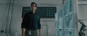 Movie still from “Voyagers” (2021), directed by Neil Burger – A man standing in front of a wall with multiple monitors; Medium shot, Over the shoulder angle
