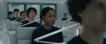 Movie still from “Voyagers” (2021), directed by Neil Burger – A group of young people sitting in a room; Close Up shot, Over the shoulder angle