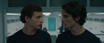 Movie still from “Voyagers” (2021), directed by Neil Burger – Two young men looking at one another in a mirror; Close Up shot, Over the shoulder angle