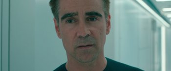 Movie still from “Voyagers” (2021), directed by Neil Burger – A person wearing a black t - shirt; Close Up shot, High angle