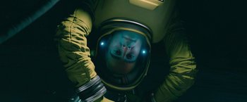 Movie still from “Voyagers” (2021), directed by Neil Burger – A person in a space suit is looking into a mirror; Medium shot, Overhead angle