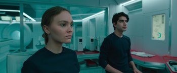 Movie still from “Voyagers” (2021), directed by Neil Burger – A man and a woman are standing in a room; Close Up shot, Low angle