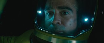 Movie still from “Voyagers” (2021), directed by Neil Burger – A person wearing a space helmet; Close Up shot, Overhead angle