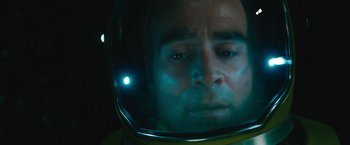 Movie still from “Voyagers” (2021), directed by Neil Burger – A person wearing a space helmet; Close Up shot, Overhead angle
