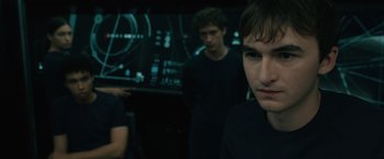 Movie still from “Voyagers” (2021), directed by Neil Burger – A group of young men standing next to each other in a room; Close Up shot, Over the shoulder angle
