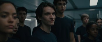 Movie still from “Voyagers” (2021), directed by Neil Burger – Two young men standing next to each other in a room; Close Up shot, Low angle