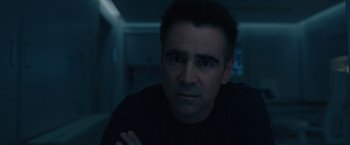 Movie still from “Voyagers” (2021), directed by Neil Burger – A person with his arms crossed; Close Up shot, Low angle