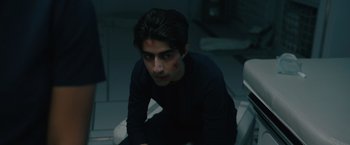 Movie still from “Voyagers” (2021), directed by Neil Burger – A young man with blood all over his face; Medium shot, High angle