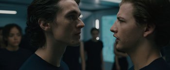 Movie still from “Voyagers” (2021), directed by Neil Burger – Two men face each other in a room; Close Up shot, Over the shoulder angle