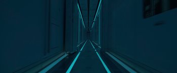 Movie still from “Voyagers” (2021), directed by Neil Burger – A long hallway with neon lights on the walls; Extreme Wide shot, Overhead angle