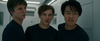 Movie still from “Voyagers” (2021), directed by Neil Burger – Two young men standing next to each other in a room; Close Up shot, Low angle