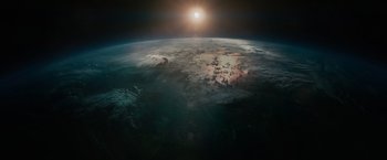 Movie still from “Voyagers” (2021), directed by Neil Burger – An aerial view of the earth at sunset; Extreme Wide shot, High angle