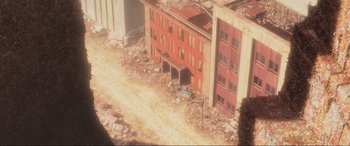 Movie still from “WALL·E” (2008), directed by Andrew Stanton – An aerial view of a building that has been demolished; Extreme Wide shot, High angle