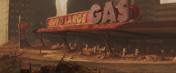 Movie still from “WALL·E” (2008), directed by Andrew Stanton – An abandoned gas station with a lot of rubble around it; Extreme Wide shot, High angle