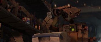 Movie still from “WALL·E” (2008), directed by Andrew Stanton – An image of a robot looking through binoculars; Extreme Close Up shot, Low angle