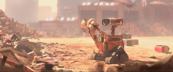 Movie still from “WALL·E” (2008), directed by Andrew Stanton – An image of an animated robot in the desert; Extreme Wide shot, Low angle