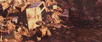 Movie still from “WALL·E” (2008), directed by Andrew Stanton – An image of an old robot in the middle of a pile of rubble; Extreme Wide shot, Overhead angle