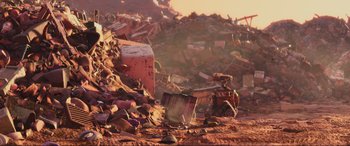 Movie still from “WALL·E” (2008), directed by Andrew Stanton – A pile of rubble with a bunch of trash on the ground; Extreme Wide shot, High angle