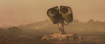 Movie still from “WALL·E” (2008), directed by Andrew Stanton – An image of an object in the middle of the desert; Extreme Close Up shot, Low angle