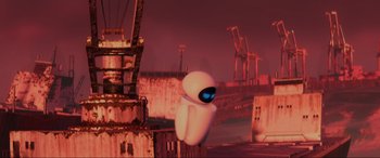 Movie still from “WALL·E” (2008), directed by Andrew Stanton – An image of an animated character in a city setting; Extreme Wide shot, Overhead angle
