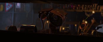 Movie still from “WALL·E” (2008), directed by Andrew Stanton – A camera is sitting on a table in the dark; Close Up shot, Low angle