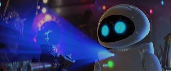 Movie still from “WALL·E” (2008), directed by Andrew Stanton – The eyes of a robot in a dark room; Close Up shot, Over the shoulder angle