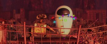 Movie still from “WALL·E” (2008), directed by Andrew Stanton – An animated robot with a christmas lights on it's head; Extreme Wide shot, Over the shoulder angle