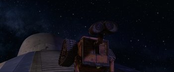 Movie still from “WALL·E” (2008), directed by Andrew Stanton – An image of an animated robot in the night sky; Extreme Wide shot, Low angle