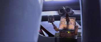 Movie still from “WALL·E” (2008), directed by Andrew Stanton – An image of an animated character from wall - e; Medium shot, Low angle