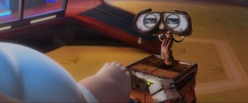 Movie still from “WALL·E” (2008), directed by Andrew Stanton – An animated character looking through a pair of binoculars; Extreme Close Up shot, Over the shoulder angle